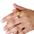 Model Wearing Multicoloured Crystal Daisy Signet Ring in Gold with white background