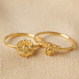 Set of 2 Daisy and Bee Stacking Rings in Gold on Neutral Fabric