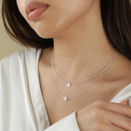 Model Wearing Set of 2 Daisy and Bee Necklaces in Silver