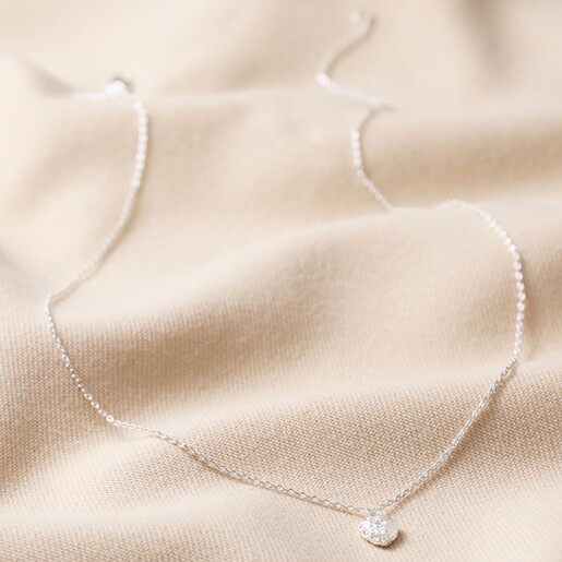 Tiny Molten Heart Pendant Necklace in Silver Full Length on Beige Fabric