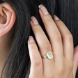 Debossed Forget Me Not Ring in Gold on Model with Hand in Hair