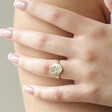 Model Wearing Debossed Forget Me Not Ring in Gold with Hand on Arm