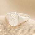 Debossed Forget Me Not Signet Ring in Silver on Beige Fabric