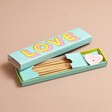 Bombay Duck Love Incense Stick and Holder Set with box open on neutral coloured background