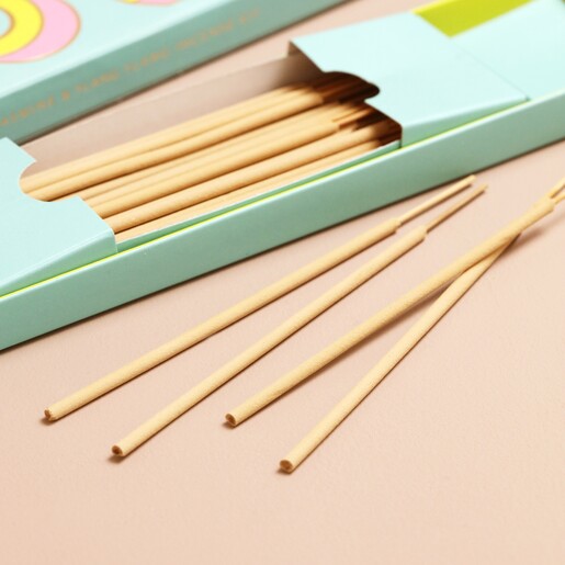 Close up of incense sticks in and out of packaging from Bombay Duck Love Incense Stick and Holder Set