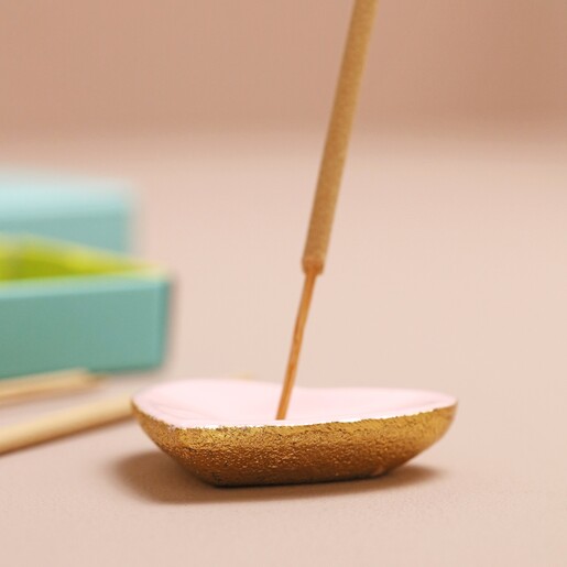 Close up of heart holder with incense stick in from Bombay Duck Love Incense Stick and Holder Set
