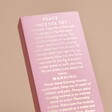 Close up of back of packaging onBombay Duck Peace Incense Stick and Holder Set