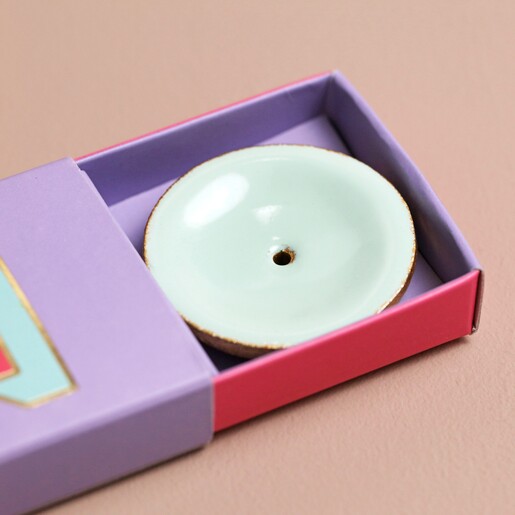 Close up of holder from Bombay Duck Wish Incense Stick and Holder Set in packaging