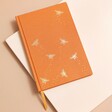 Orange Bee Fabric Notebook on neutral background