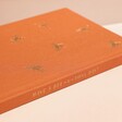Orange Bee Fabric Notebook spine showing quote