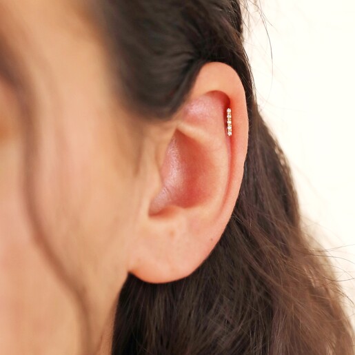 Tish Lyon Solid Gold Crystal Microbar Barbell on model with neutral background