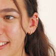 Model wearing Tish Lyon Solid Gold Star Barbell with curated ear look