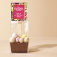 Cocoba Mini Egg Hot Chocolate Spoon in Packaging with Pink Background