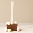 Cocoba Mini Egg Hot Chocolate Spoon Out of Packaging on Neutral Background