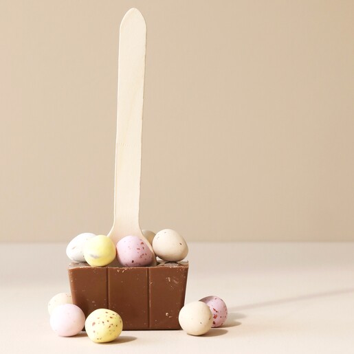 Cocoba Mini Egg Hot Chocolate Spoon Out of Packaging on Neutral Background