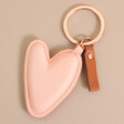 Caroline Gardner Vegan Leather Peach Heart Keyring on Neutral Background