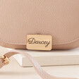 Close Up on Personalisation on Gold Clasp on Pink Personalised Vegan Leather Crossbody Bag