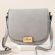 Grey Personalised Vegan Leather Crossbody Bag on Neutral Coloured Background