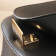 Close Up of Clasp on Black Personalised Vegan Leather Crossbody Bag Open