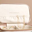 Estella Bartlett X Charly Clements Mini Cream Jewellery Case Close Up of Open Lid and Logo