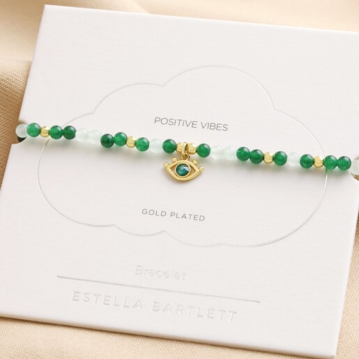 Estella Bartlett Evil Eye Beaded Bracelet in Gold on Packaging Card