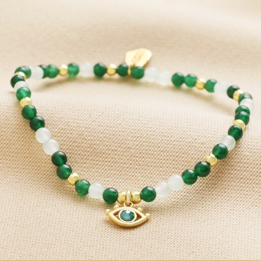 Estella Bartlett Evil Eye Beaded Bracelet In Gold on Neutral Coloured Material