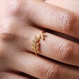 Close Up of Adjustable Sterling Silver Crystal Fern Leaf Ring in Gold on Model