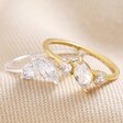 Sterling Silver Clear Crystal Ring With Gold Option on Neutral Fabric