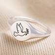 Sterling Silver Dove Embossed Signet Ring on Neutral Fabric