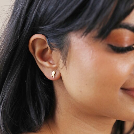 Sterling Silver Octopus Stud Earrings in Gold on Model