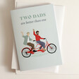 Two Are Better Than One Father's Day Card Laid on Top of Envelope with White Backdrop