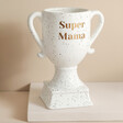 'Super Mama' Personalised Ceramic Speckled Trophy Against Neutral Background