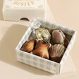 Close Up of The World Is Your Oyster Praline Seashell Chocolates Inside Box