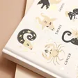 Close up on front cover of Designworks Ink Zodiac Jumbo Notebook