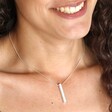 Model smiling wearing Bar Pendant Necklace in Silver
