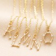 K-O Crystal Constellation Initial Necklaces in Gold on Neutral Fabric