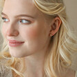 Model Looking to Side Wearing Crystal Pizza Stud Earrings in Gold