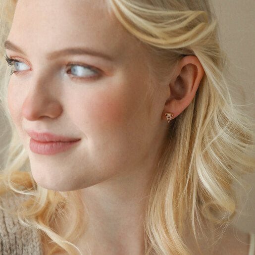 Earrings on Model Model Looking to Side Wearing Crystal Pizza Stud Earrings in Gold