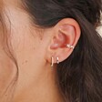 Model Wearing Crystal Star Ear Cuff in Silver With Other Earrings