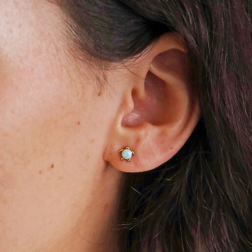 Close Up of Green Opal Turtle Stud Earrings in Gold on Model