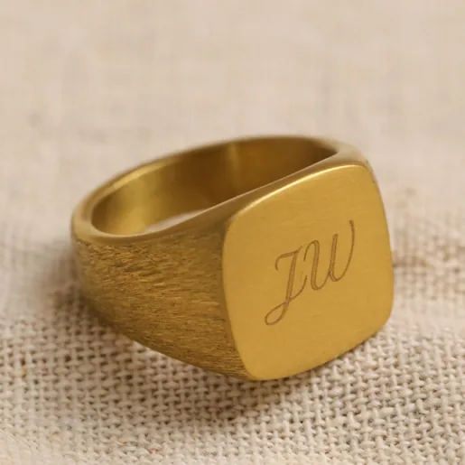 Men's Gold Plated Personalised Brushed Stainless Steel Signet Ring on Beige Fabric