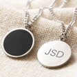 Front and Back of Men's Personalised Stainless Steel Black Onyx Stone Pendant Necklace on Beige Fabric