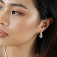 Close Up of Model Wearing Mint Green Organic Resin Hoop Earrings in Gold