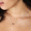 Close up of model wearing Mixed Metal Tiny Interlocking Hearts Necklace in Silver