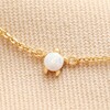 Close up of charm on Opal Turtle Charm Bracelet in Gold