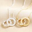 Personalised Interlocking Pearl and Crystal Hoops Necklaces in Silver and Gold on Beige Fabric