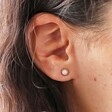 Close Up of Pink Opal Flower Stud Earrings in Gold on Model
