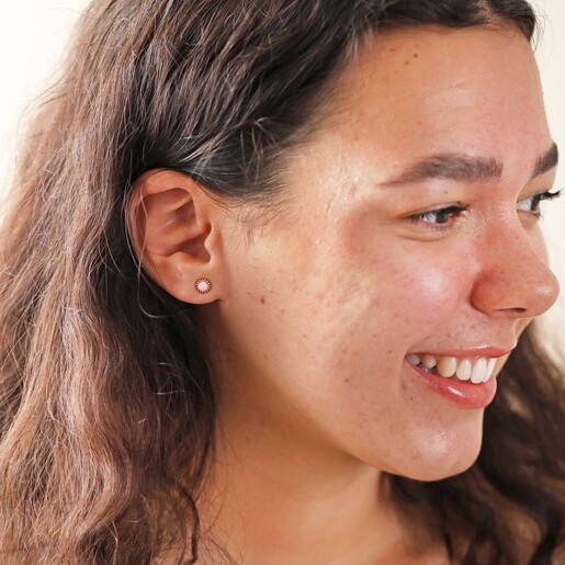Earrings on Model Model Smiling Looking to Side Wearing Pink Opal Flower Stud Earrings in Gold