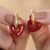 Model Holding Red Resin Heart Huggie Hoop Earrings in Gold in Front