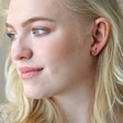 Blonde Model Wearing Triple Crystal Stud Earrings in Gold